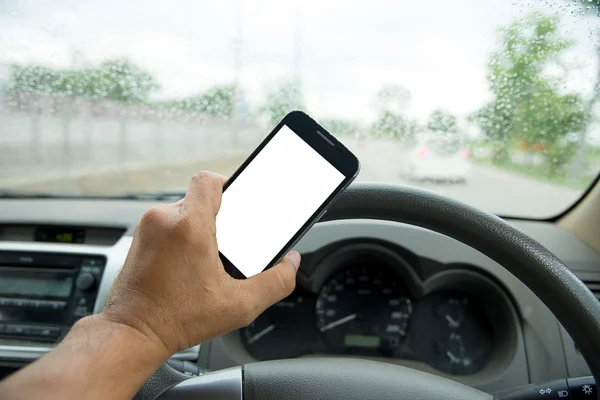 People play smart phones  while driving the car,road\'s raining u