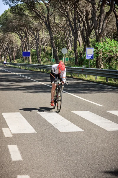 Grosseto, Italy - May 09, 2014: The cyclist without an arm and feet with the bike during the sporting event