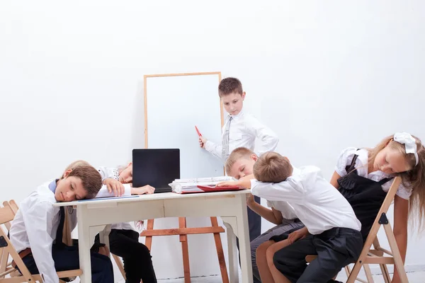 The group of teenagers sitting in a business meeting