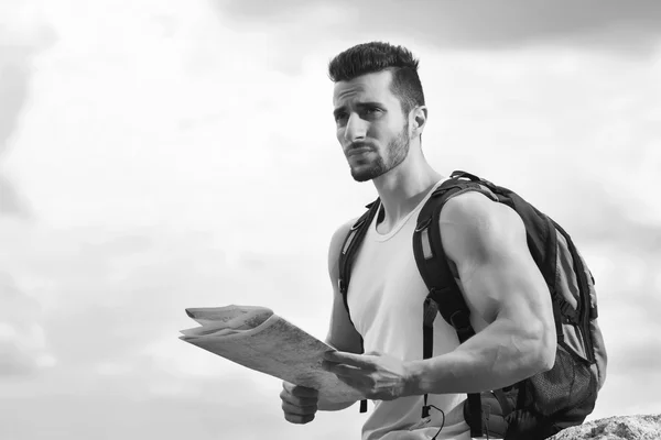 Black and white photo of a tourist with backpack