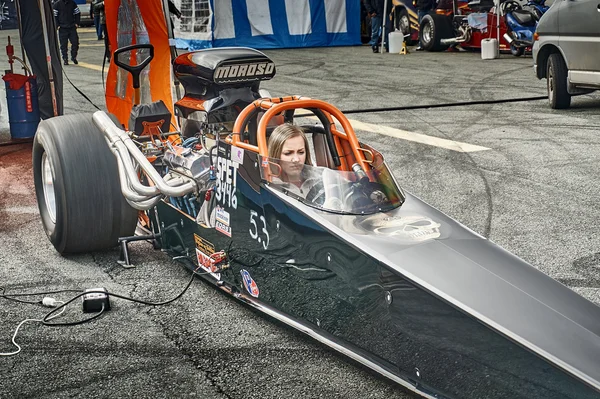 Norway drag racing, driver in a black race car front view