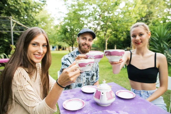 Group of friends having tea