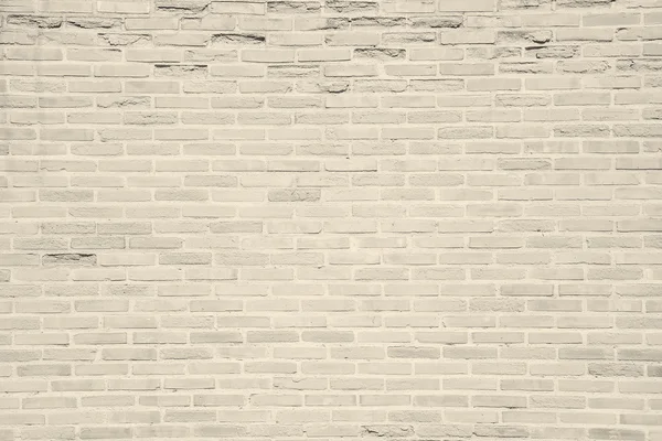 Light beige grunge brick wall texture background