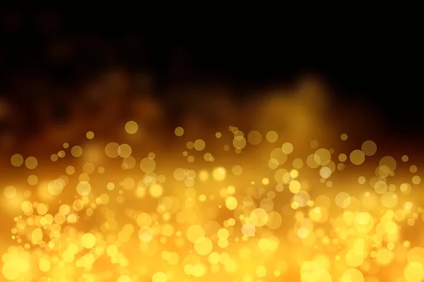Blurred Golden Bokeh Background with sparkles and glitter.Golden