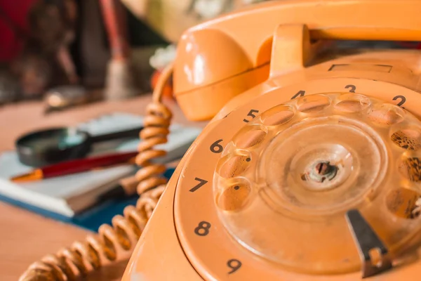 Old-style rotary phone numbers.