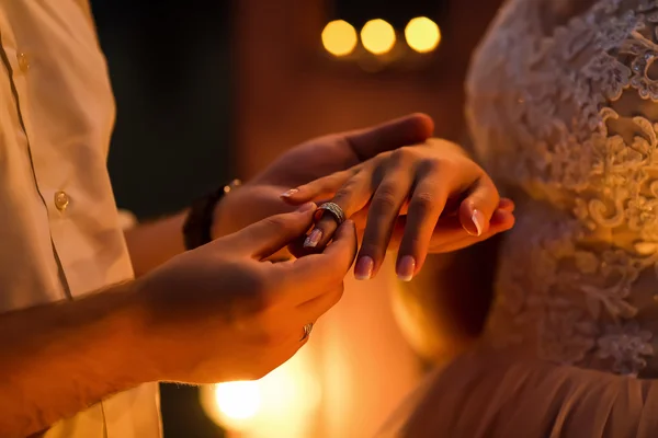 Wedding ceremony. The groom wears a ring