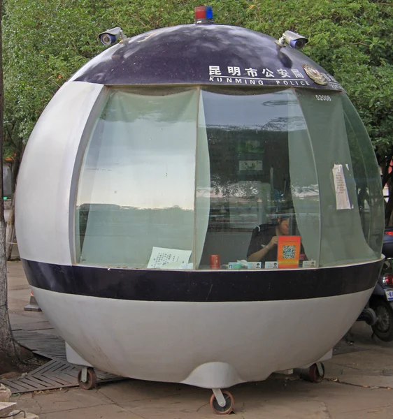 Police officer is working in portable station, Kunming, China