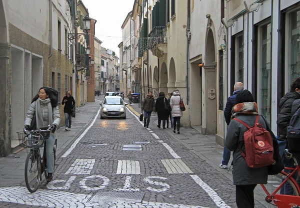 People are walking on the street in Padua, Italy