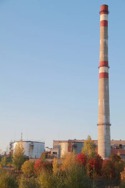 Smoke stack on the fabric in Russia, autumn landscape