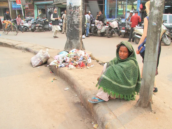 Homeless woman waits somewhat nearly mosque in Delhi