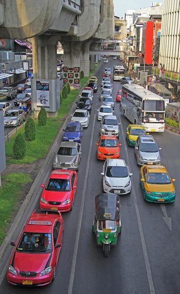 People in cars, buses and on motorbikes are moving, Bangkok, Thailand