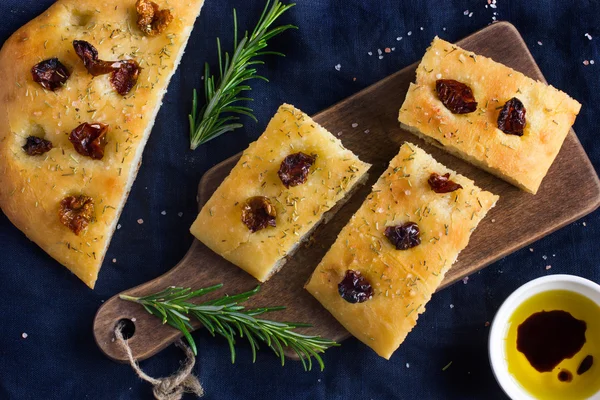 Italian focaccia bread with sun dried tomatoes, rosemary and sea