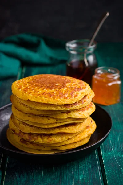Stack of pumpkin pancakes with nuts