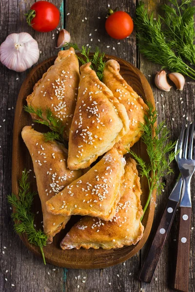 Fresh baked  pasties filled with meat and vegetable
