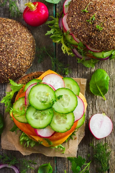 Healthy fast food. Rye burgers with fresh vegetables, chickpeas