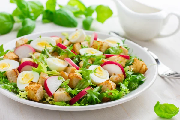 Salad with chicken and quail eggs