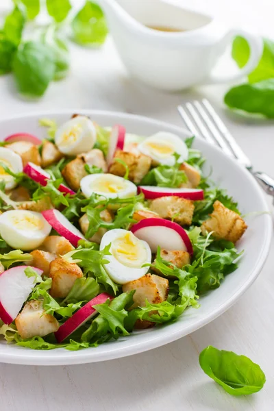 Salad with chicken and quail eggs