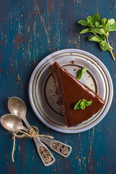 Chocolate cake with mint leaves