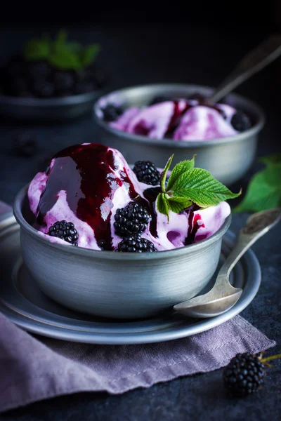 Delicious homemade blackberry  ice cream with blackberry topping