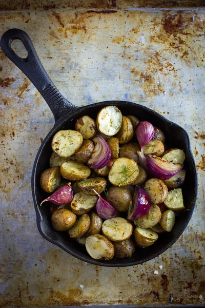 Roasted potatoes with  onions, carrot and garlic