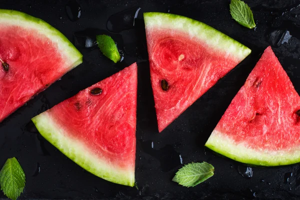 Fresh watermelon on black background
