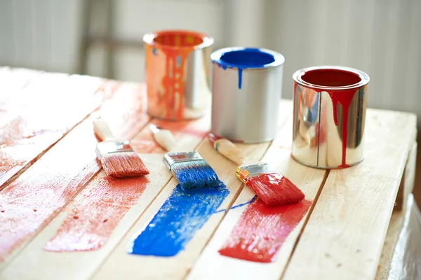 Paint cans and brushes