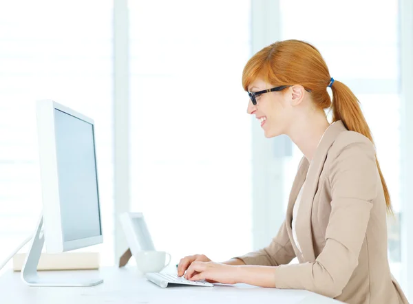 Businesswoman typing on the computer