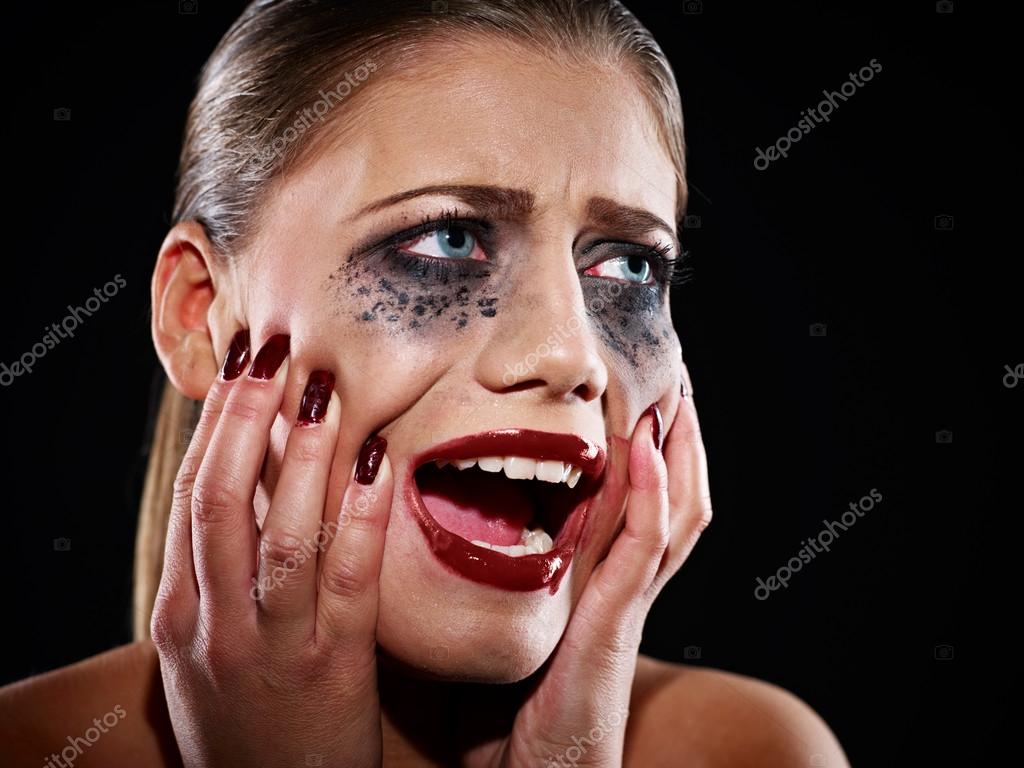Hysteric woman with smeared makeup — Stock Photo © nesharm 66497999