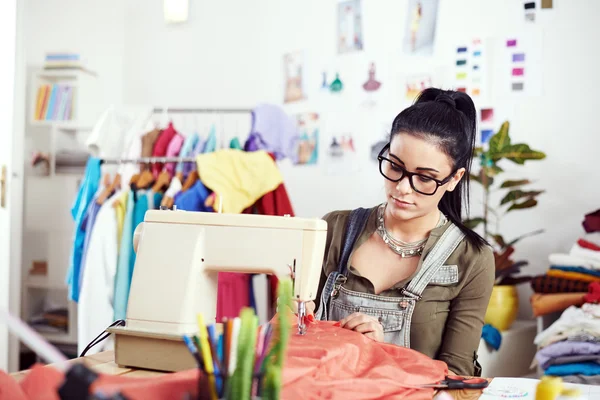 Designer working on sewing machine