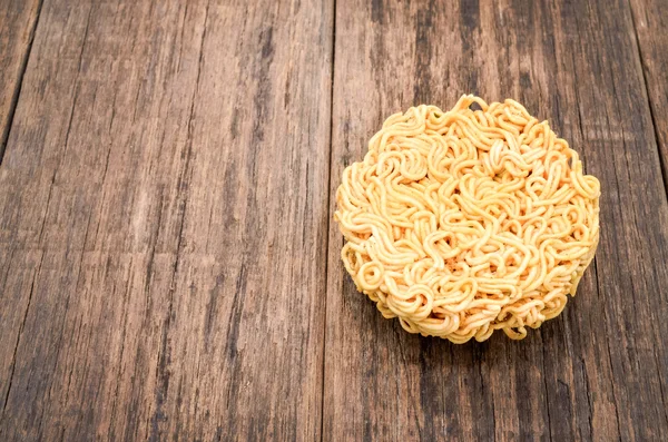 Instant noodle on a wooden table background