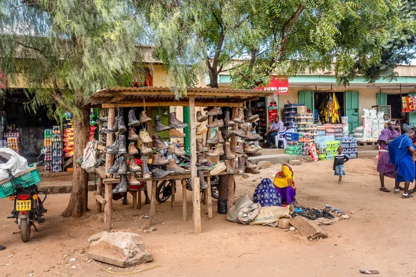 Street shops and vendors selling used boots in Kenya