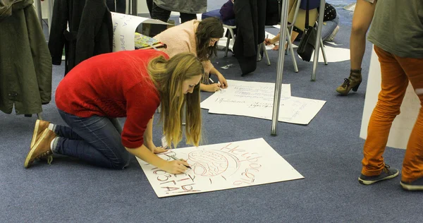 Posters depicting two women on the floor
