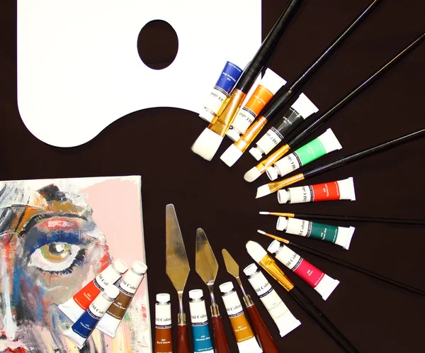 Palette with paintbrushes
