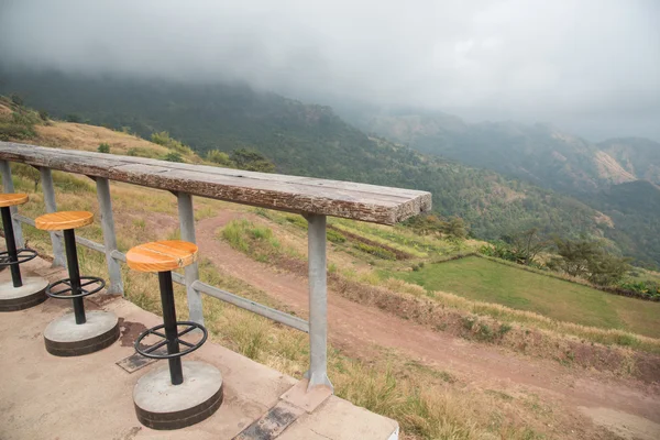 Outdoor bar counter and bar stools with beautiful natural