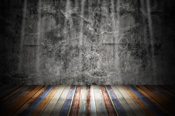 Light in dark room with colorful wooden floor and grunge stone