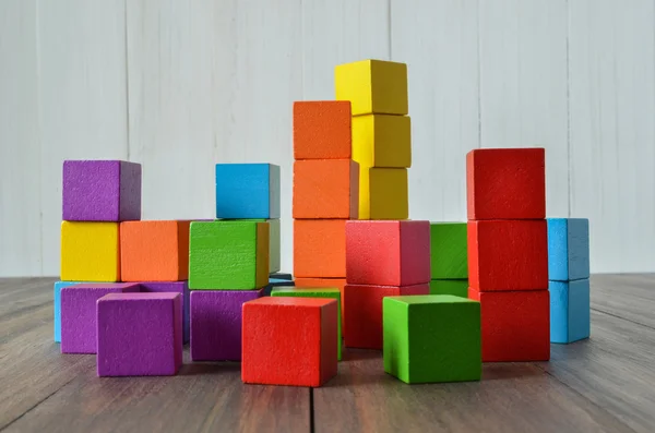 Colorful stack of wood cube building blocks