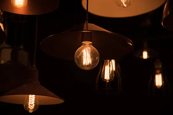 Hanging light bulbs in the dark room