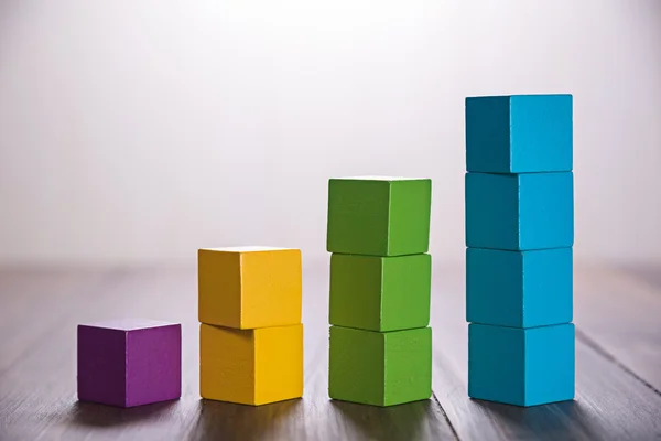 Colorful stack of wood cube building blocks