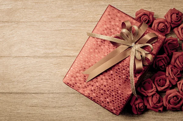 Red gift box on wood background