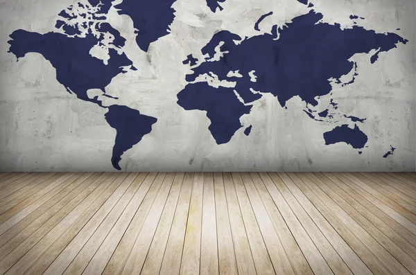 World map on grunge wall and wooden floor