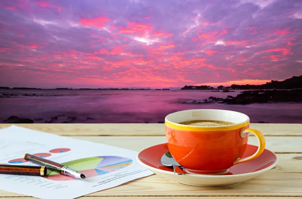 Coffee cup with sunrise sky background