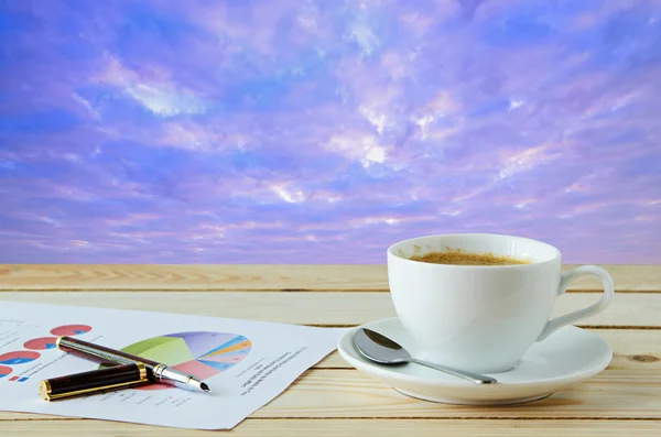 Coffee cup with sunrise sky background