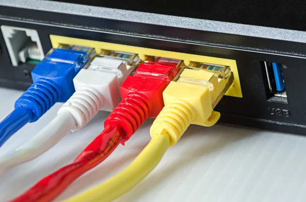 Ethernet cables connect to router or switch