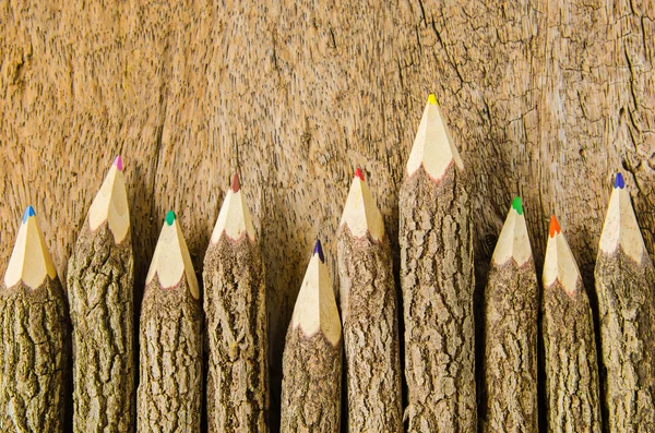 Wooden pencils on wood background