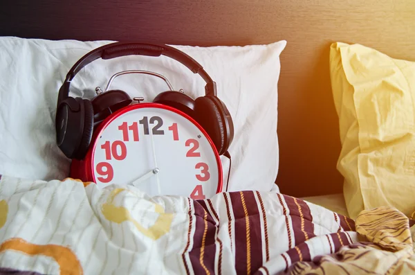 Alarm clock sleeping in bed