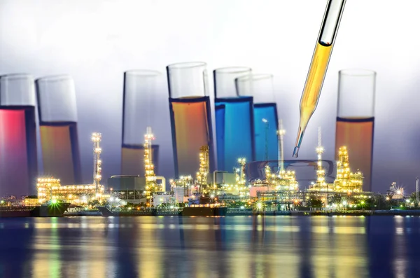 Double exposure of laboratory test tube and Oil refinery plant