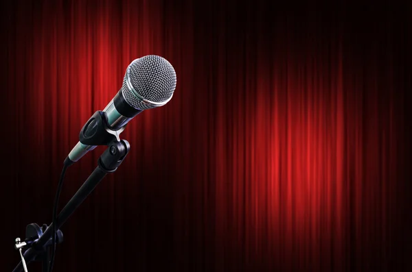 Microphone on Red Curtain Stage Background with light spots