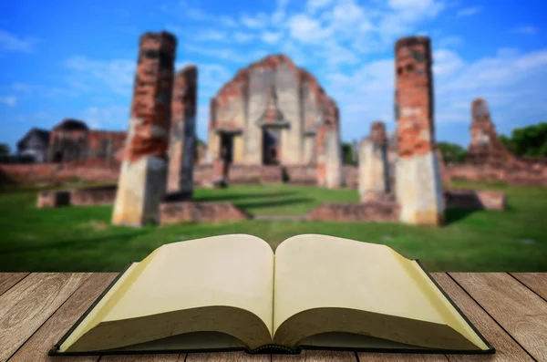 Open book with old historical temple background