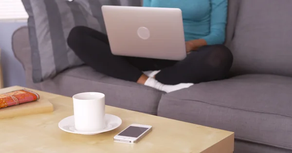 Black woman working from home on laptop