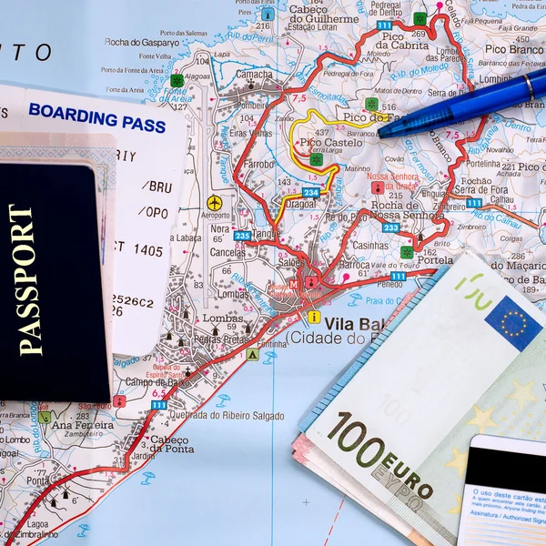 International travel concept. Passport, boarding pass, money, credit card, pen on map of tropic island.